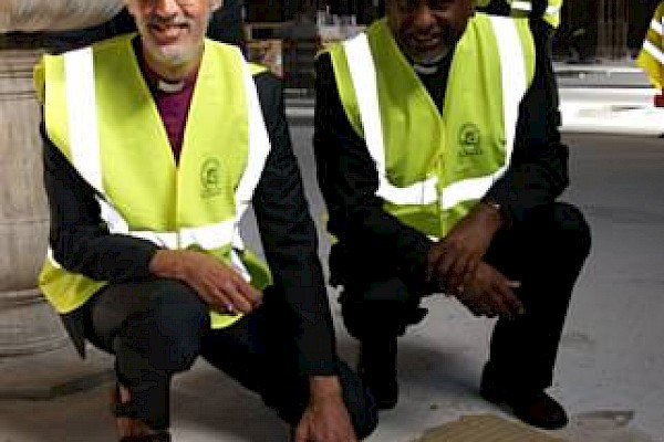 The Dean of Manchester and Bishop of Manchester Elect lay the first stone of the new Cathedral floor